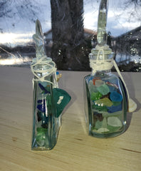 SET OF 2 BOTTLES OF SEA GLASS AS SHOWN