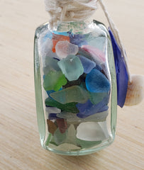 SET OF 2 BOTTLES OF SEA GLASS AS SHOWN