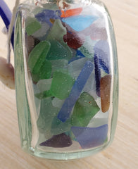 SET OF 2 BOTTLES OF SEA GLASS AS SHOWN